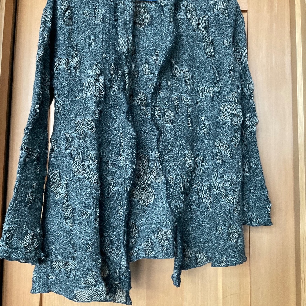 100% wool cardigan in taupes and shades of black in size medium